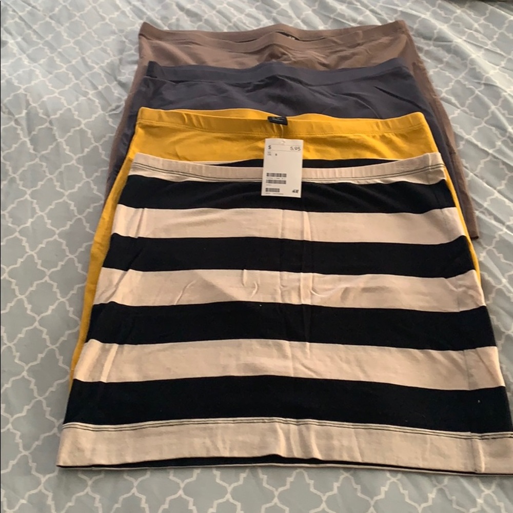 A bundle of 4 mini skirts.  Never worn with tags